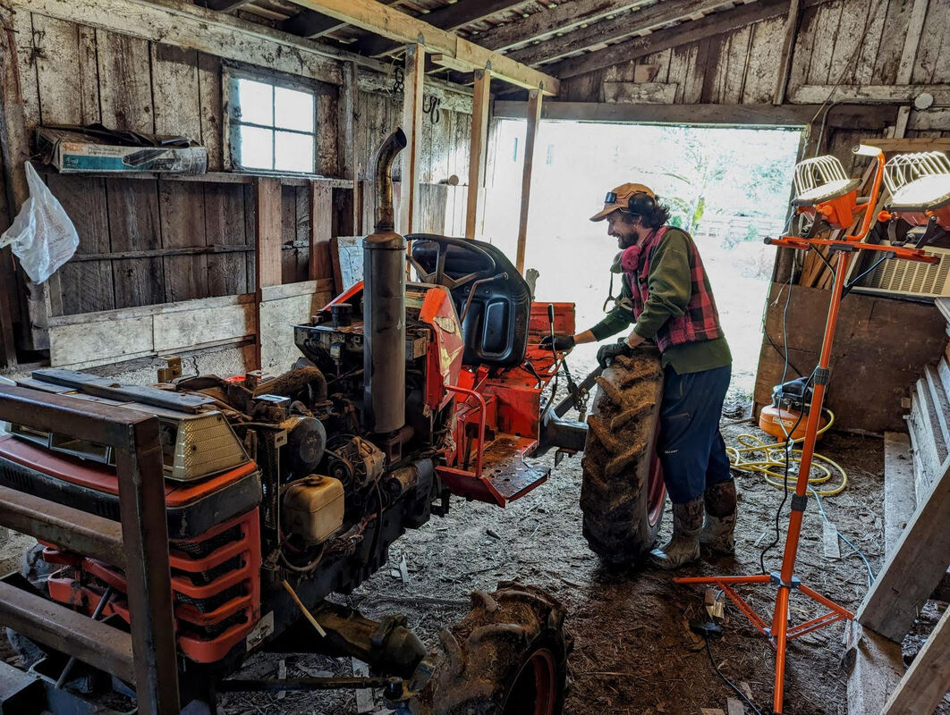Person working on a tractor